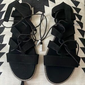 Black lace up sandals with tassels
